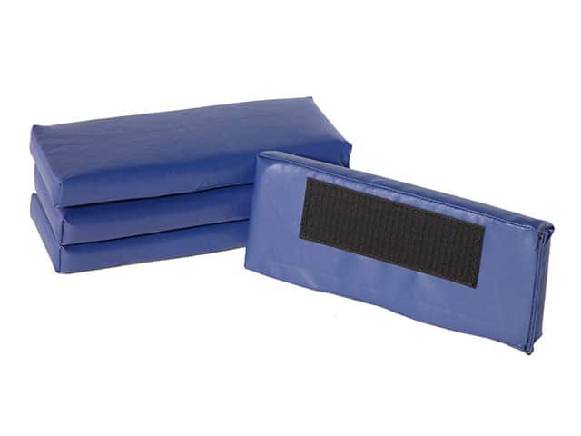 Three stacked arm rest pads with one laid against the stack showing velcro on the bottom of the pads